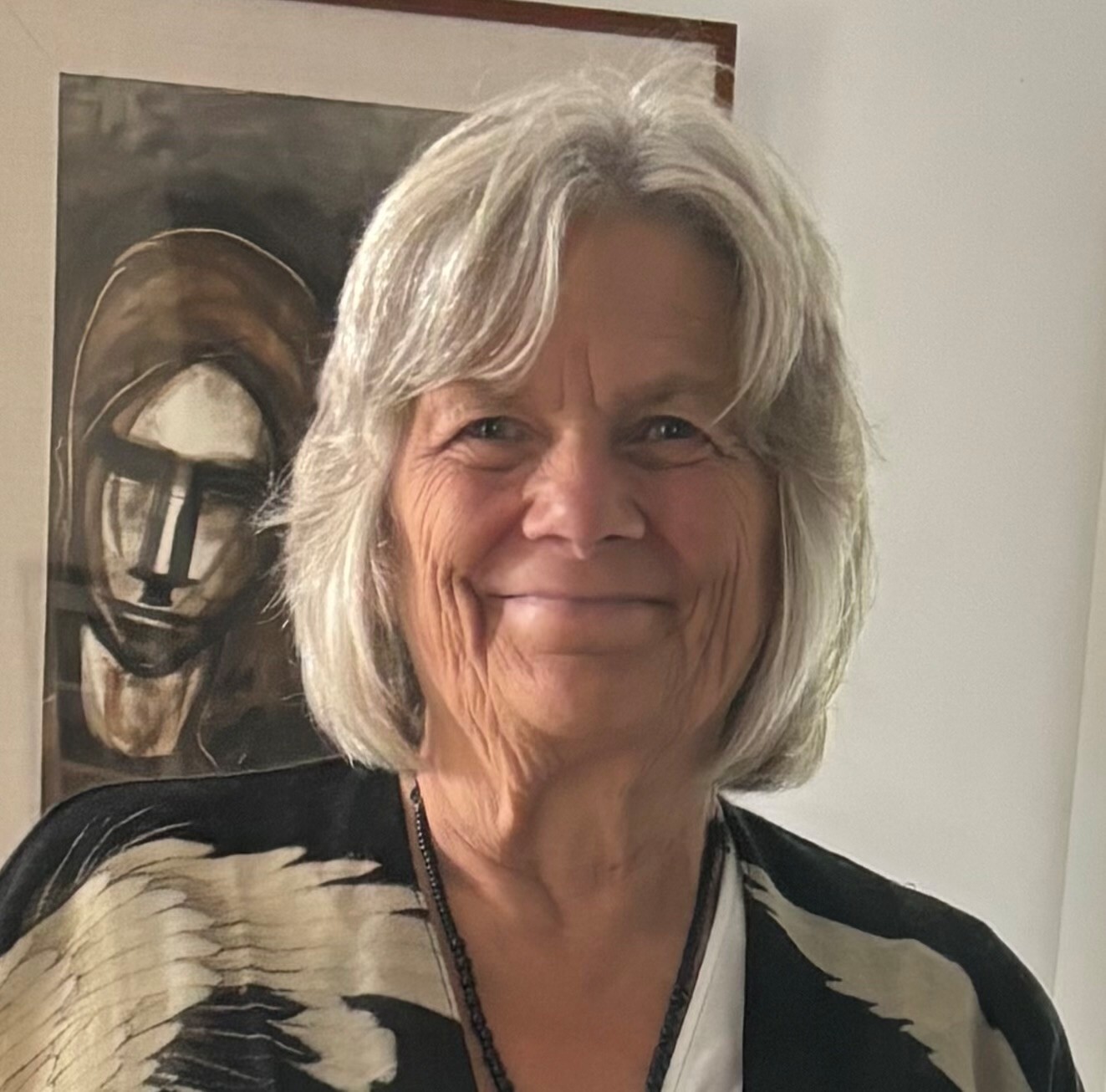 HEad and shoulders shot of Fionnuala facing the camera and smiling