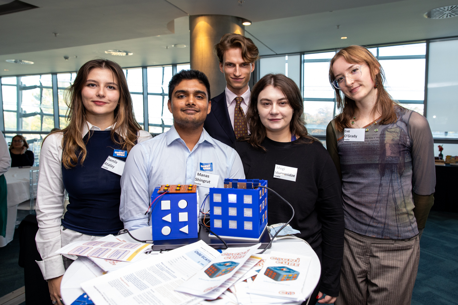 Cogni Cube Team standing in front of their prototype