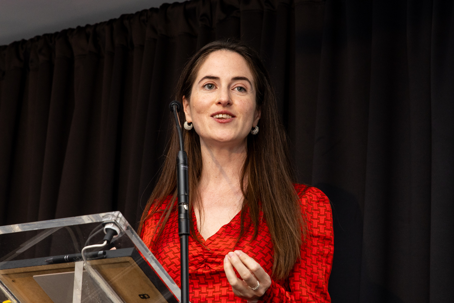 Aoife Kelly speaking at the lectern